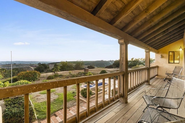 wooden deck with a rural view