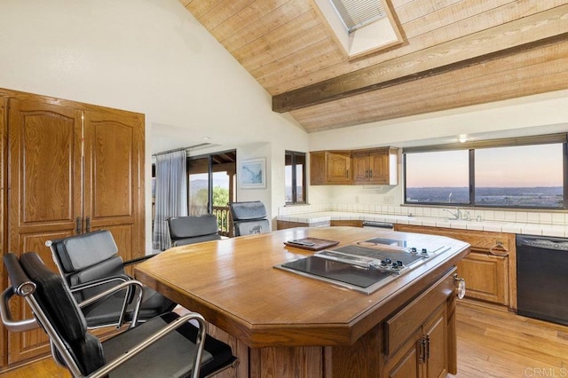 kitchen with black appliances, a kitchen island, vaulted ceiling with beams, light hardwood / wood-style floors, and wooden ceiling