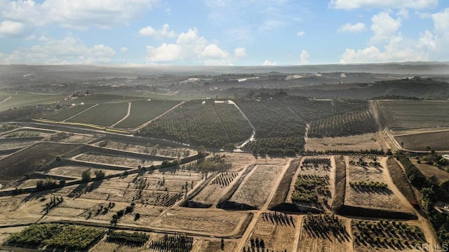 birds eye view of property featuring a rural view