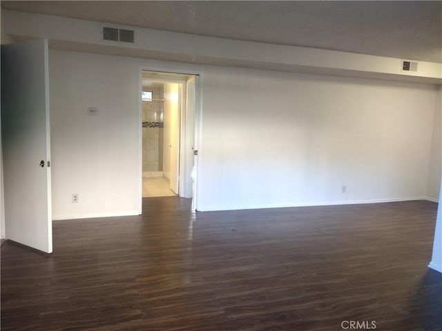 unfurnished room featuring dark hardwood / wood-style floors