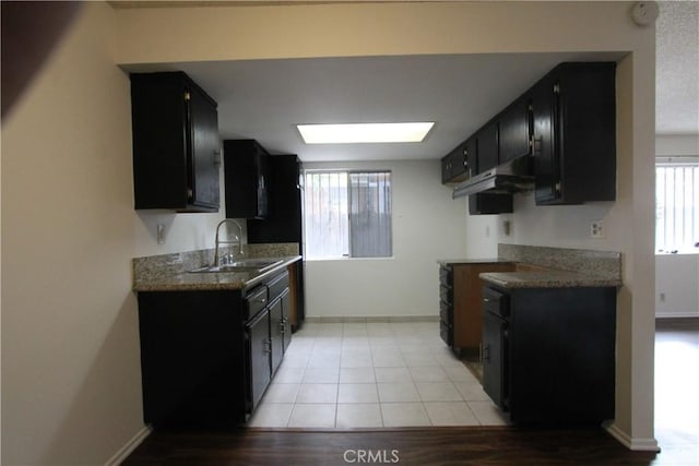 kitchen featuring sink and light tile patterned floors