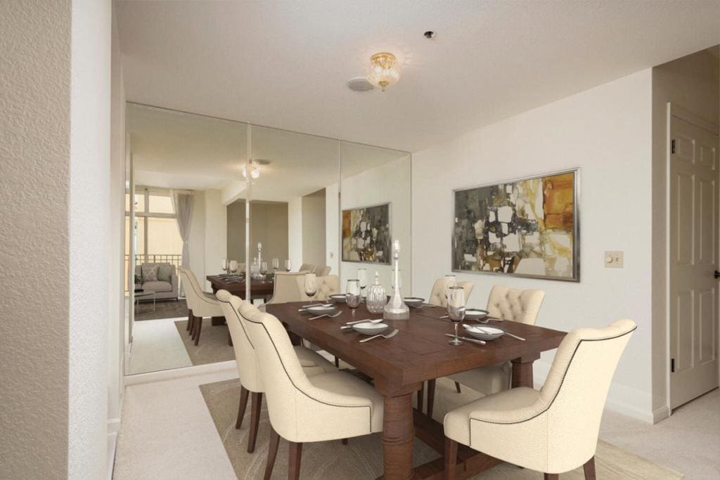 dining space with light colored carpet