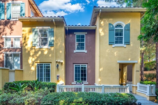 rear view of property featuring covered porch