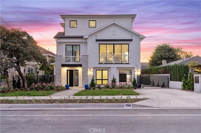 view of front of home with a balcony