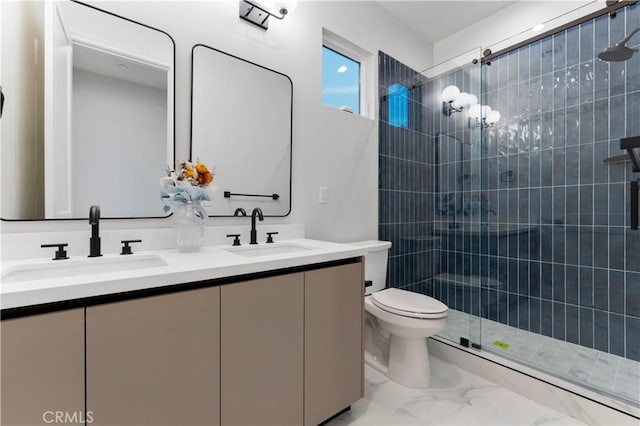 bathroom with vanity, toilet, and an enclosed shower