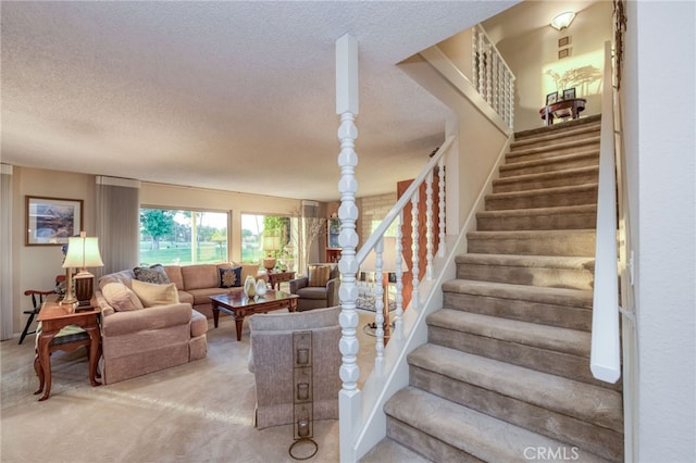 carpeted living room with a textured ceiling