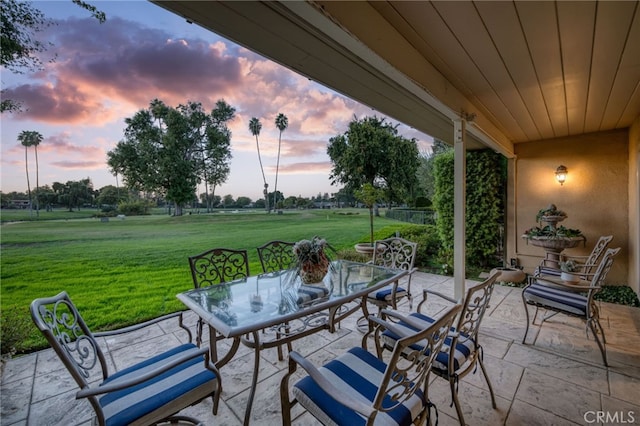 patio terrace at dusk with a lawn