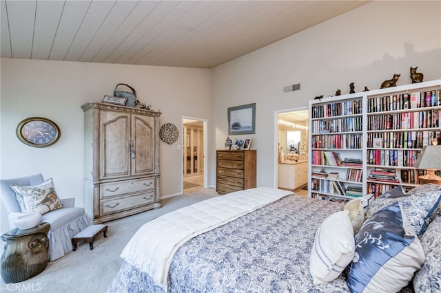 carpeted bedroom featuring vaulted ceiling