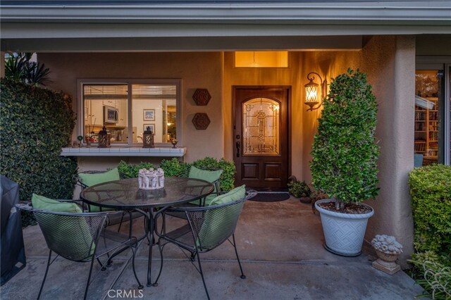 doorway to property with a patio