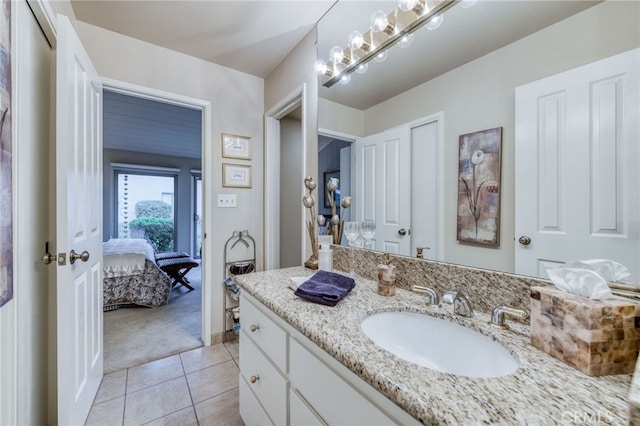 bathroom featuring tile patterned flooring and vanity