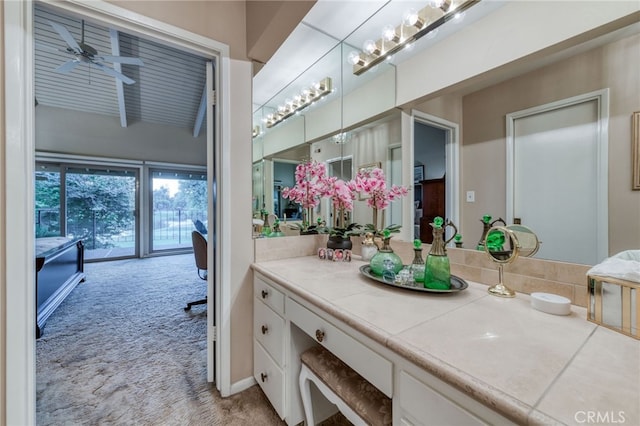 bathroom with ceiling fan and vanity