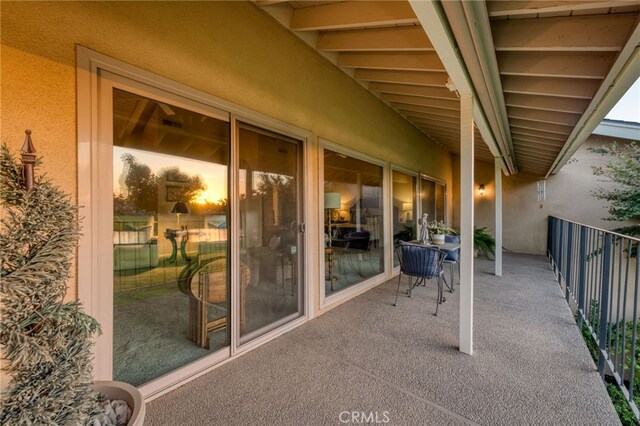 view of patio featuring a balcony