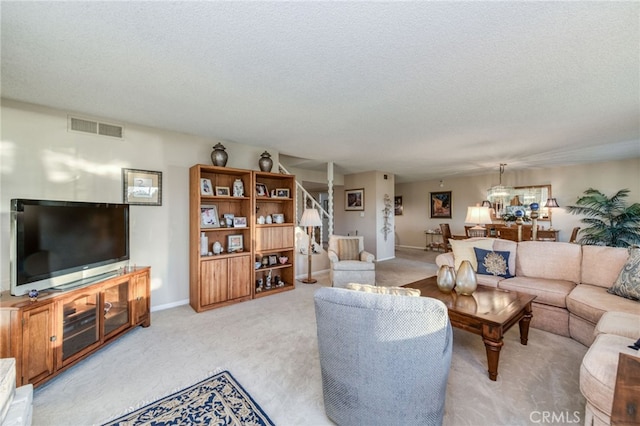 carpeted living room with a textured ceiling