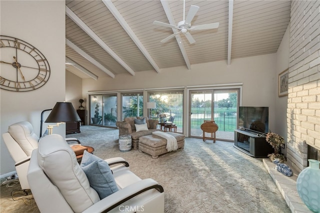 living room featuring beam ceiling, high vaulted ceiling, ceiling fan, and carpet floors