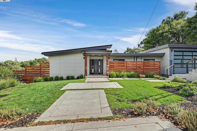 exterior space featuring a yard and french doors