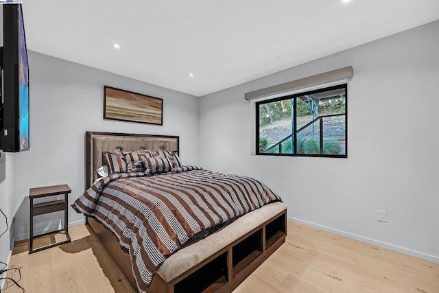 bedroom with light wood-type flooring