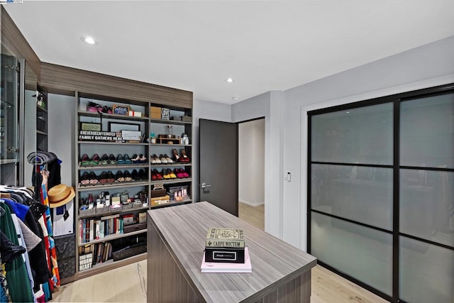 walk in closet featuring light wood-type flooring