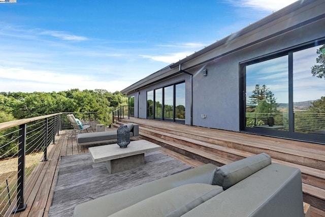 wooden deck with outdoor lounge area