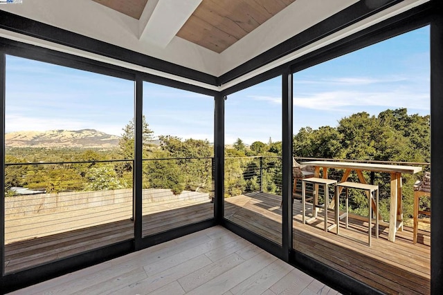 sunroom / solarium with a mountain view