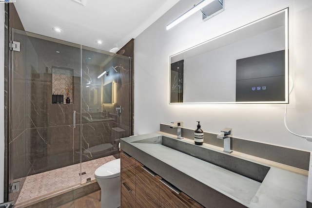 bathroom featuring an enclosed shower, tile patterned floors, vanity, and toilet