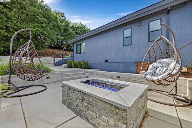 view of patio featuring an outdoor fire pit