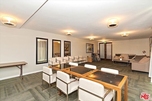 view of carpeted dining space