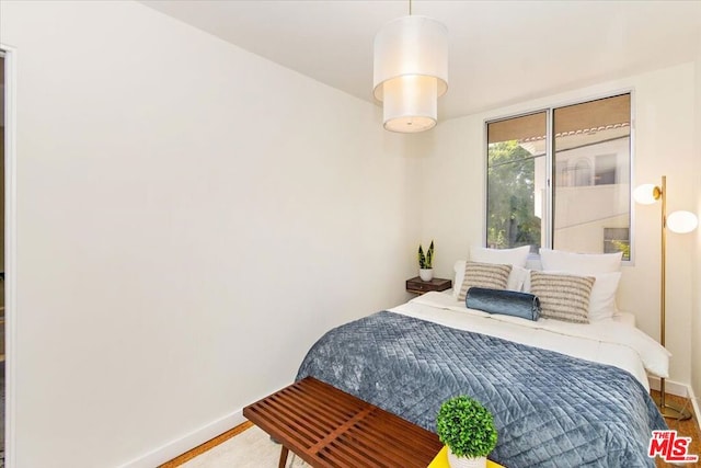 bedroom featuring wood-type flooring