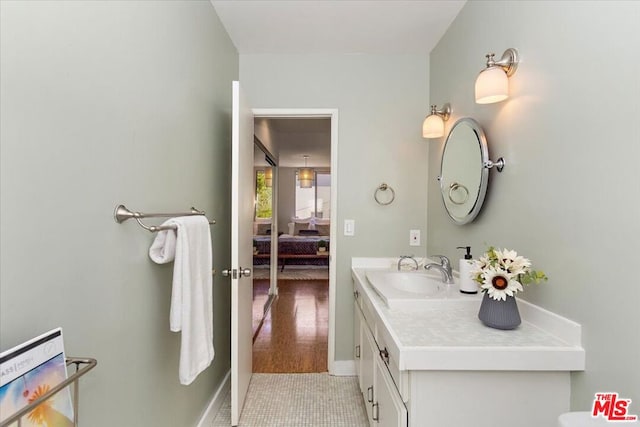 bathroom featuring hardwood / wood-style floors and vanity