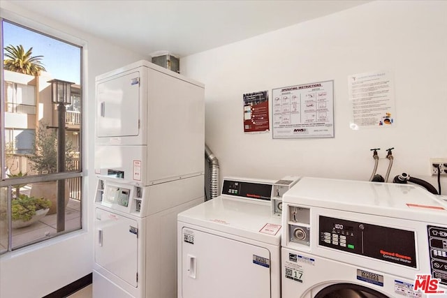 laundry room featuring separate washer and dryer and stacked washing maching and dryer