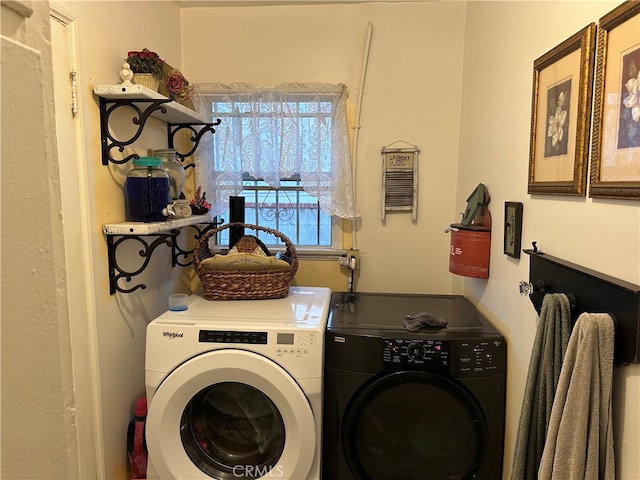 laundry room featuring separate washer and dryer