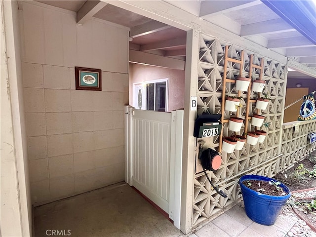 wine area with beamed ceiling