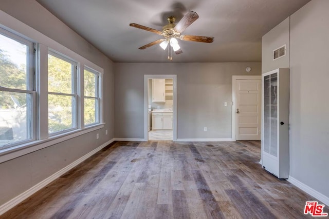 unfurnished room featuring ceiling fan and light hardwood / wood-style floors