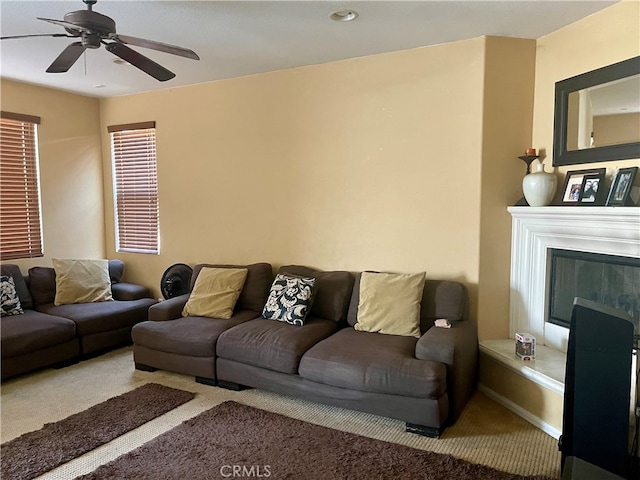 living room with carpet floors and ceiling fan