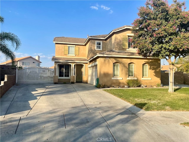 view of front of home with a front yard and a garage