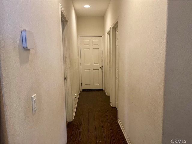 hall with dark wood-type flooring