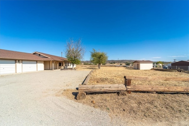 view of yard with a garage