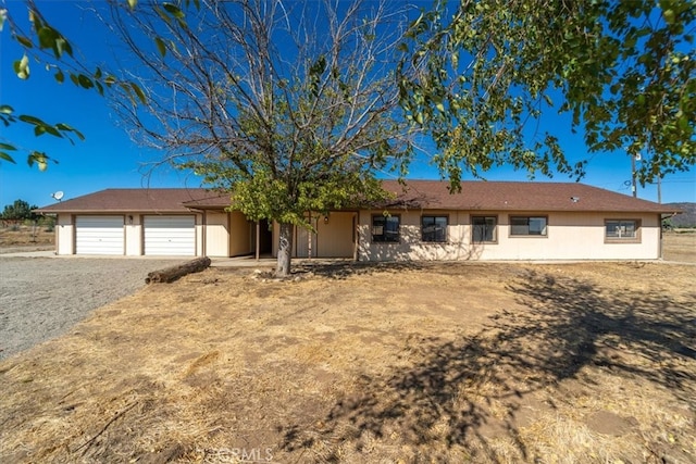 single story home featuring a garage