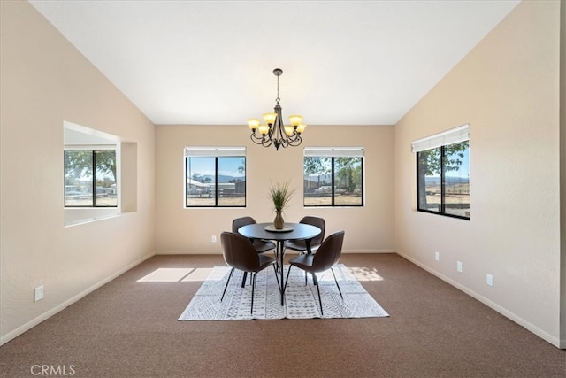 carpeted dining space featuring vaulted ceiling and an inviting chandelier