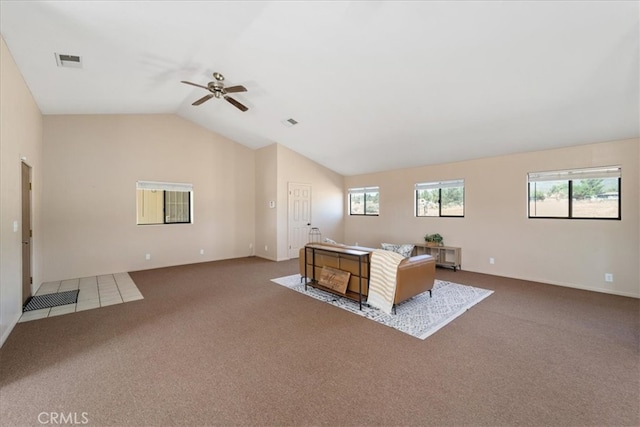 unfurnished living room featuring lofted ceiling, carpet, and ceiling fan