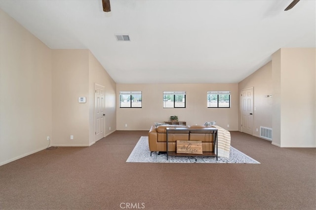 office area featuring ceiling fan, vaulted ceiling, a wealth of natural light, and light carpet