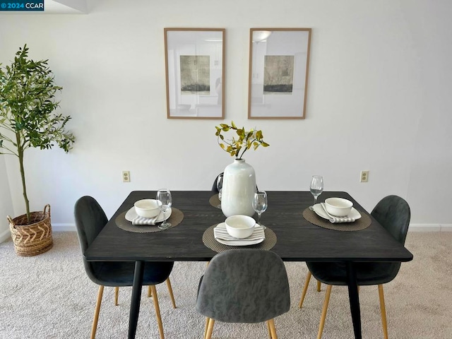 dining room featuring carpet