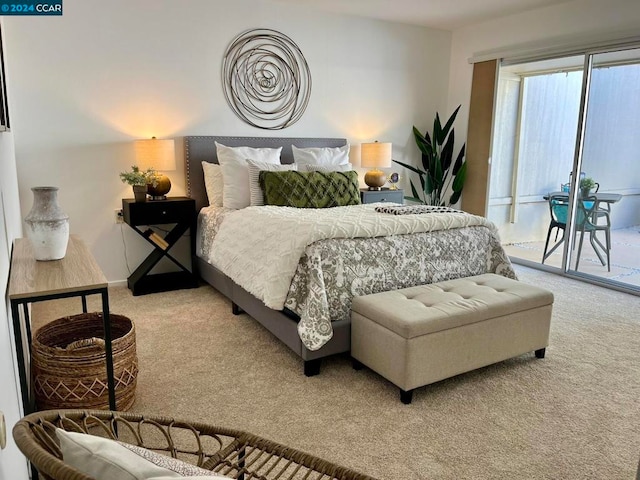 carpeted bedroom featuring access to outside