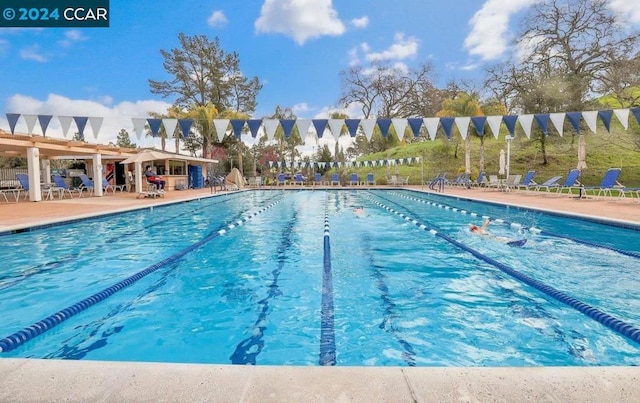 view of swimming pool featuring a patio