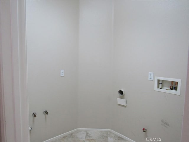 washroom featuring hookup for a washing machine, hookup for a gas dryer, and light tile patterned flooring