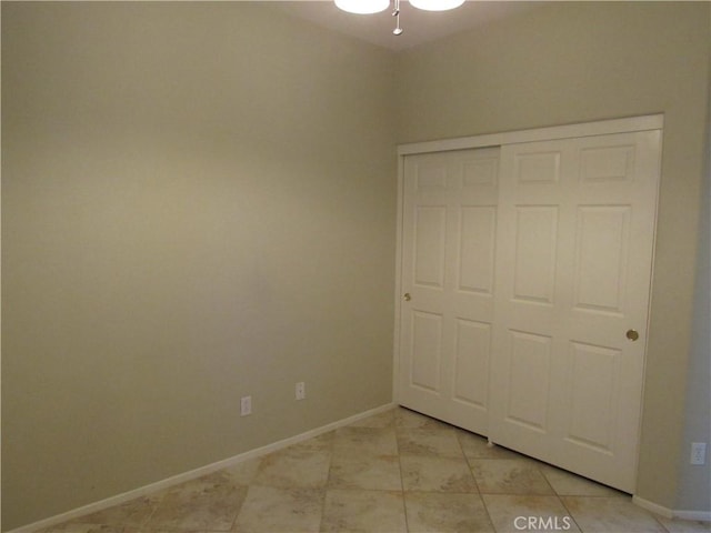 unfurnished bedroom with a closet