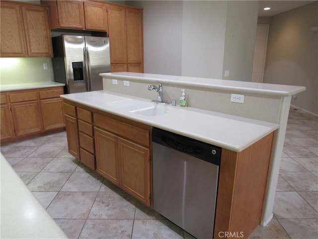 kitchen with light tile patterned floors, sink, and appliances with stainless steel finishes