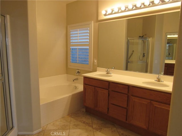 bathroom with separate shower and tub, tile patterned floors, and vanity