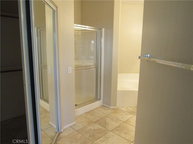 bathroom with plus walk in shower and tile patterned floors