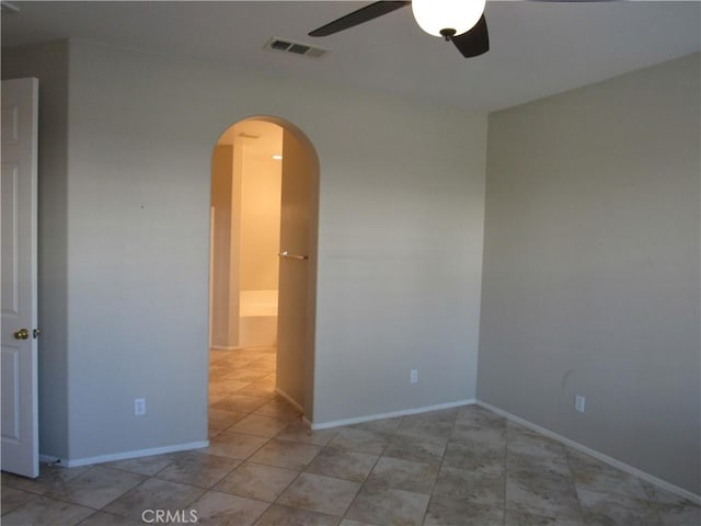 unfurnished room featuring ceiling fan and light tile patterned floors