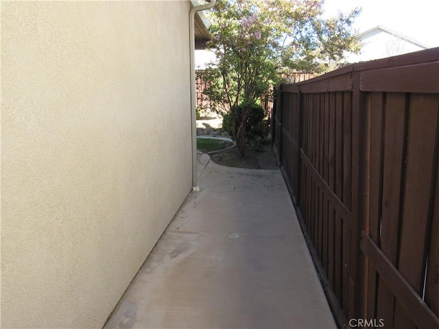 view of side of property featuring a patio